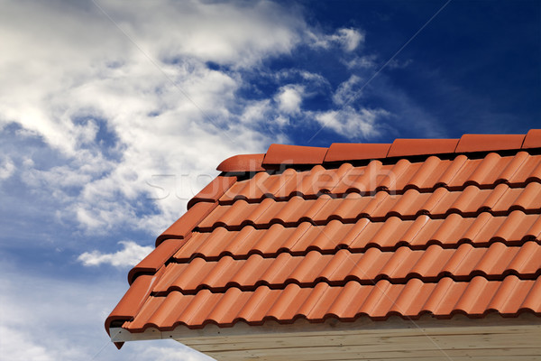 Roof tiles and sky with clouds at sunny day Stock photo © BSANI