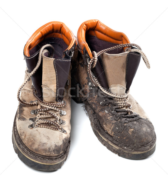 Pair of old dirty trekking boots Stock photo © BSANI