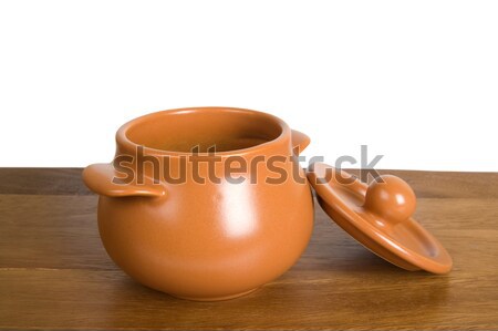 Kitchen clay pot on the wooden board Stock photo © BSANI
