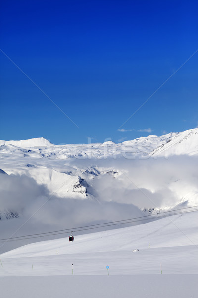 Winter snowy mountains and ski slope at nice day Stock photo © BSANI