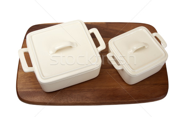 Two ceramic pots for stove on wooden kitchen board Stock photo © BSANI