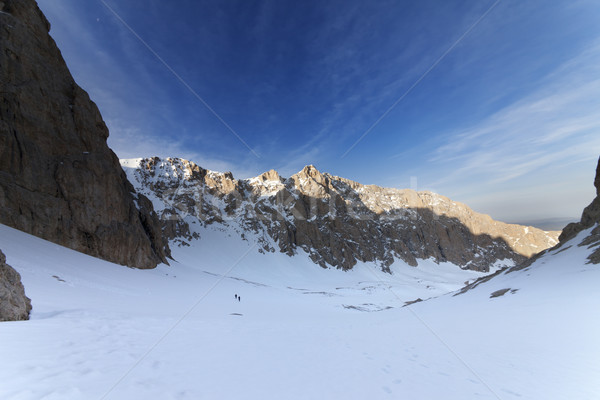 Two hikers on snowy mountains in morning Stock photo © BSANI