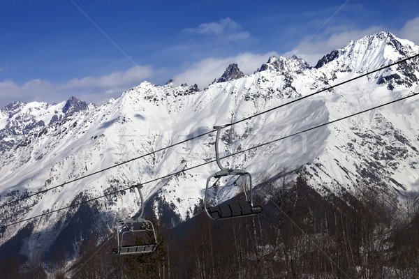 Ski resort with chair lift and snow mountains at nice sunny day Stock photo © BSANI