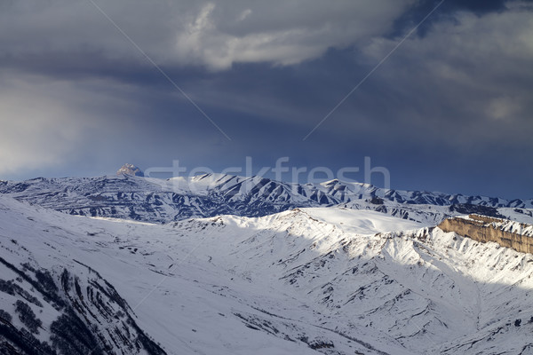 Winter mountains at evening and storm clouds Stock photo © BSANI