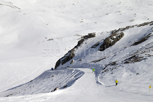 Snowboarders and skiers on groomed slope Stock photo © BSANI