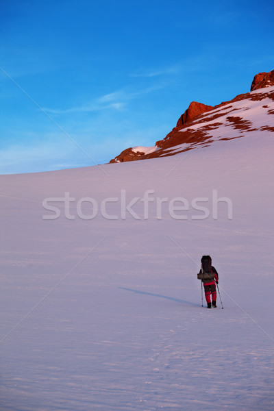 Hiker in sunrise mountains Stock photo © BSANI
