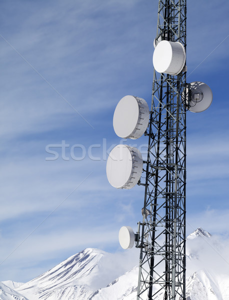 Satellite dishes in snowy mountains at sun day Stock photo © BSANI