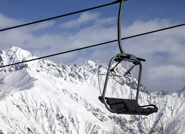 Chair lift in snowy mountains at nice sunny day Stock photo © BSANI