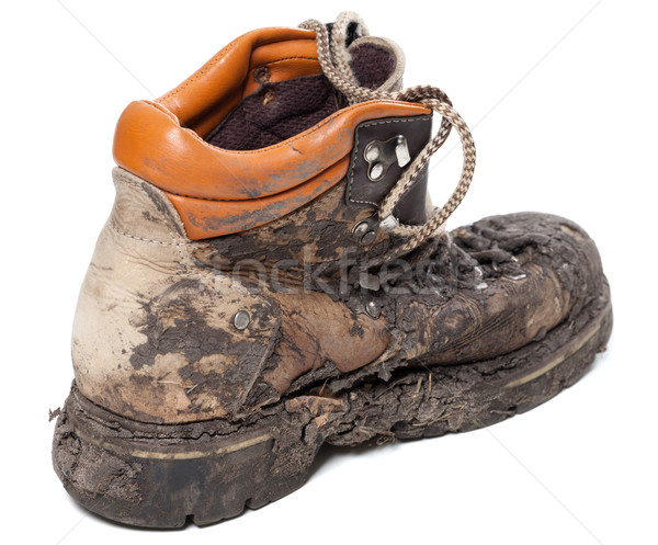 Old dirty trekking boot Stock photo © BSANI