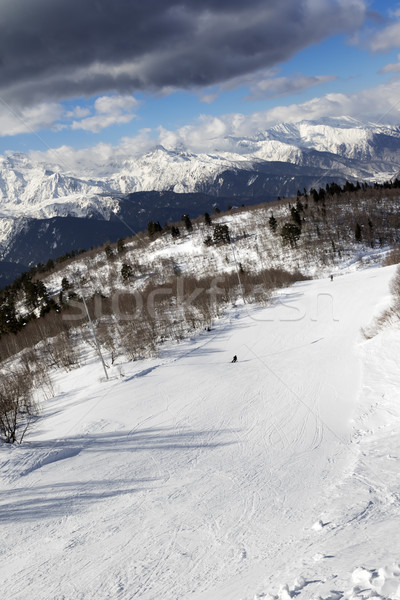 Skiers on ski slope at sun winter day Stock photo © BSANI