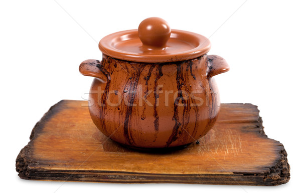 Dirty ceramic pot on old kitchen board Stock photo © BSANI