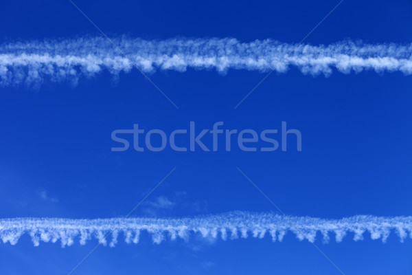 Blue sky and condensation trails Stock photo © BSANI