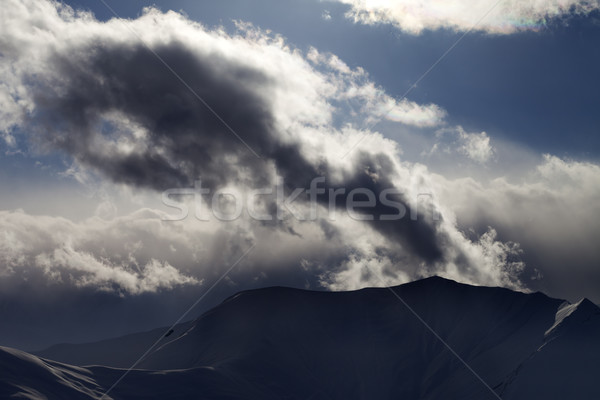 Stok fotoğraf: Akşam · karanlık · dağ · güneş · ışığı · bulutlar · görmek