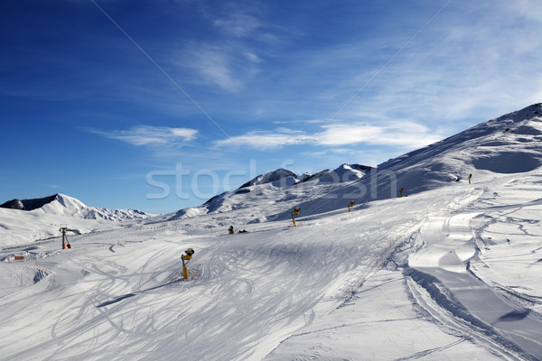 Ski slope with snowmaking at sun morning Stock photo © BSANI
