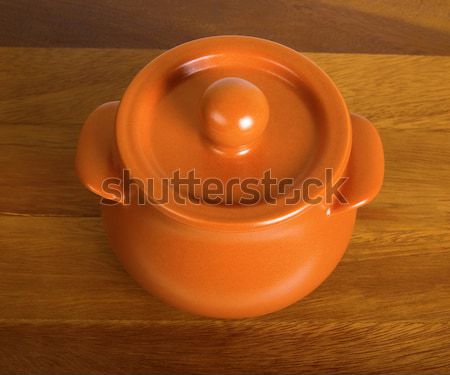 Clay pot on the wooden board Stock photo © BSANI
