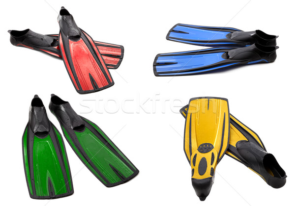 Set of multicolor swim fins for diving on white background Stock photo © BSANI