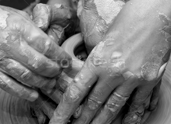 Beginner and teacher in process of making clay bowl on pottery w Stock photo © BSANI