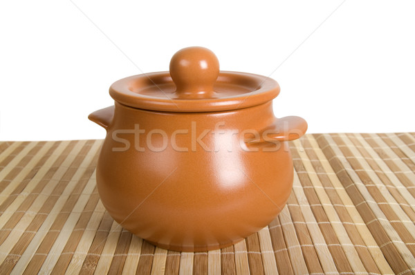 Clay pot on the striped mat Stock photo © BSANI