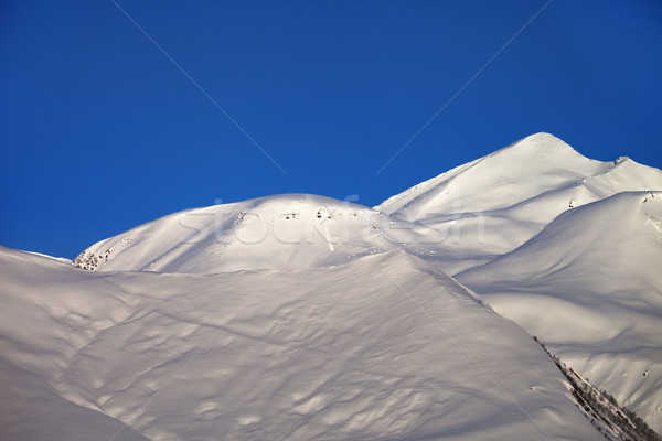Off-piste slope and blue clear sky in nice winter morning Stock photo © BSANI