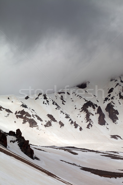 Snowy mountains in fog Stock photo © BSANI