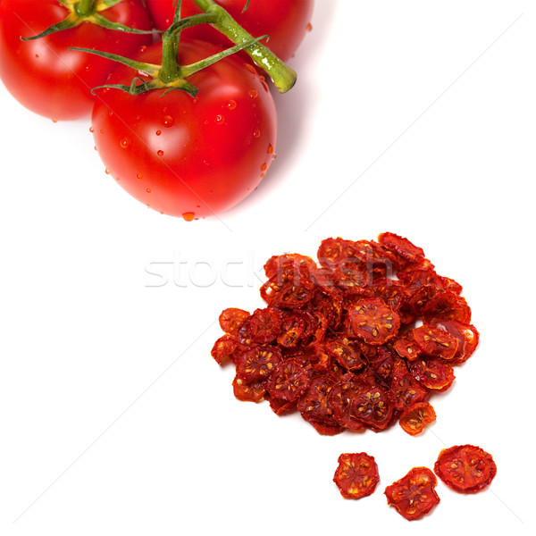 Ripe tomato with water drops and dried slices of tomato Stock photo © BSANI