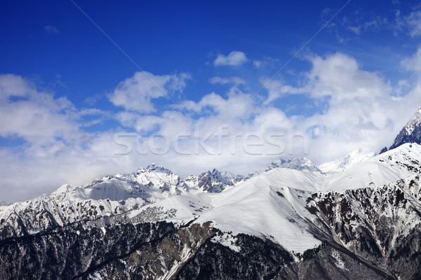 Stock photo: Snow winter mountains in clouds