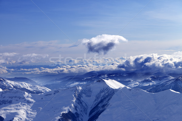 Winter mountains at nice evening and sunlight clouds Stock photo © BSANI