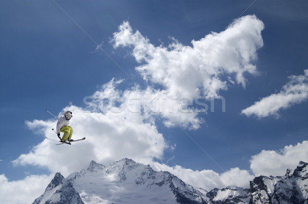 Stock photo: Freestyle ski jumper with crossed skis