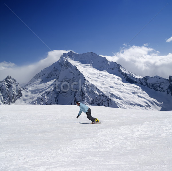 Stock photo: Snowboarder in high mountains