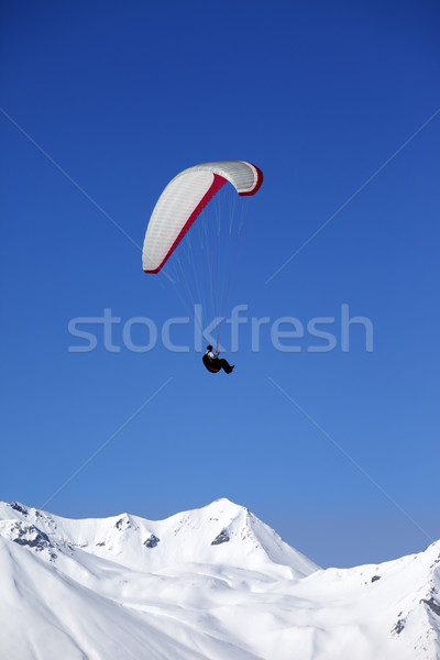 Paraglider in snowy winter mountains Stock photo © BSANI