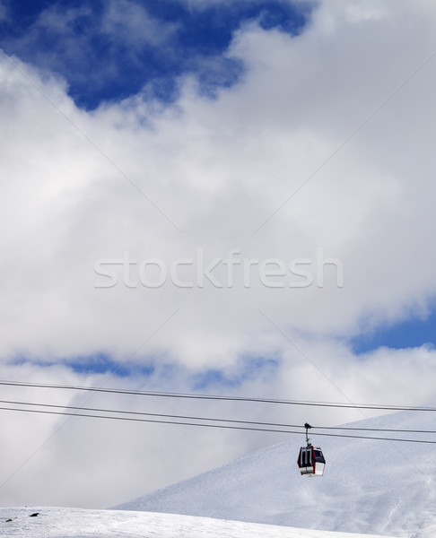 Gondola lift and off-piste slope at sun day Stock photo © BSANI