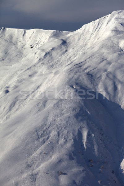 Off-piste slope with trace from skis, snowboards and avalanche Stock photo © BSANI