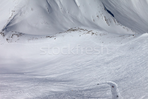 Snowboarders and skiers on slope and off-piste slope with trace  Stock photo © BSANI