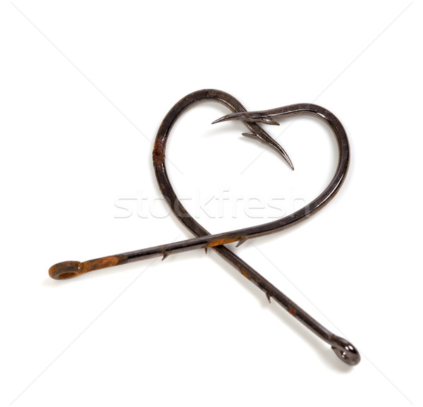 Old fish hooks in form of heart Stock photo © BSANI