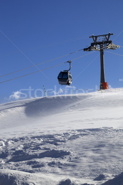 Gondola lift on ski resort at windy sun day Stock photo © BSANI