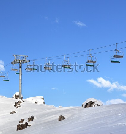 Chair-lift at ski resort at sun day after snowfall Stock photo © BSANI