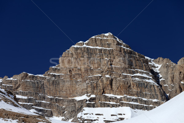 Rocks in snow and blue clear sky Stock photo © BSANI