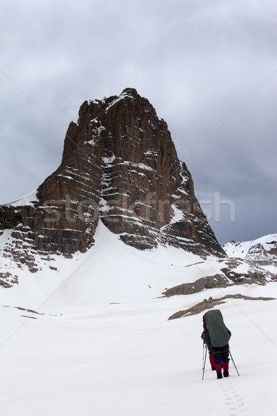 Two hikers at snowy storm mountains Stock photo © BSANI