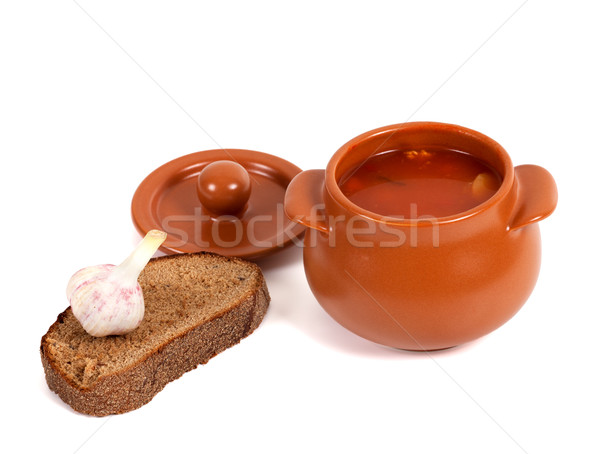 Borsch in clay pot with bread and garlic Stock photo © BSANI