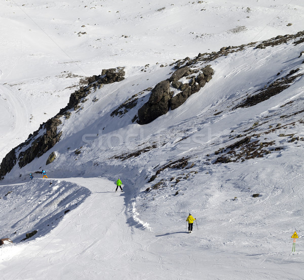 Snowboarders and skiers on groomed slope Stock photo © BSANI