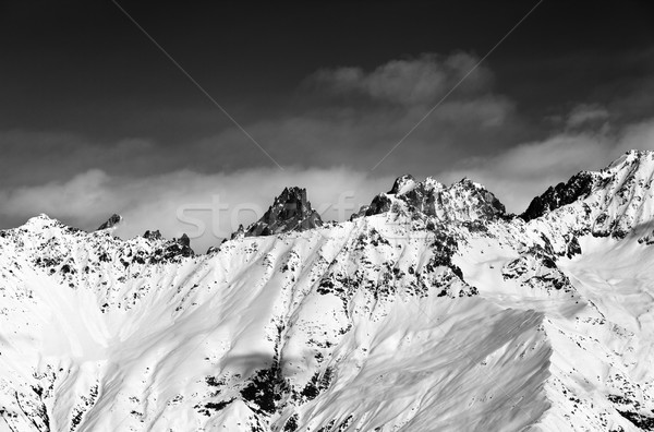 Black and white view on snowy mountains at sun day Stock photo © BSANI