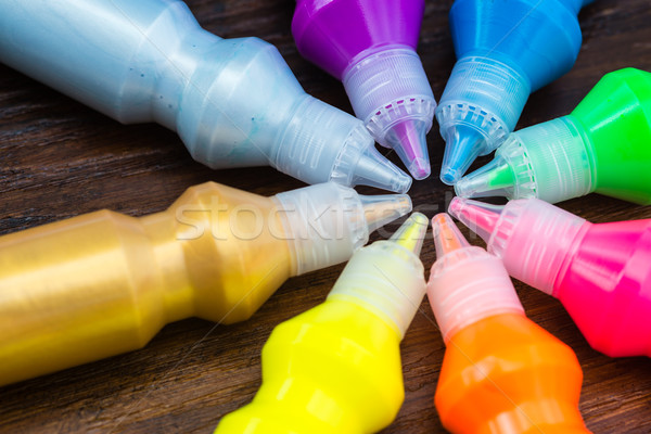 Bottles with colorful dry pigments on wooden background Stock photo © bubutu