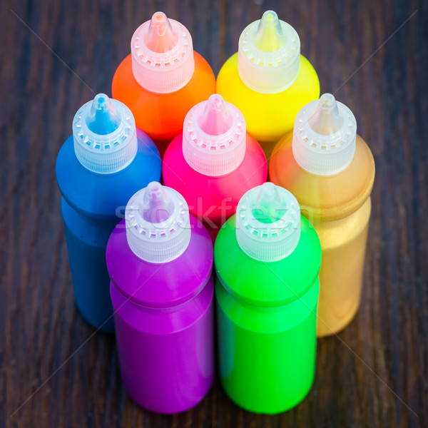 Bottles with colorful dry pigments on wooden background Stock photo © bubutu