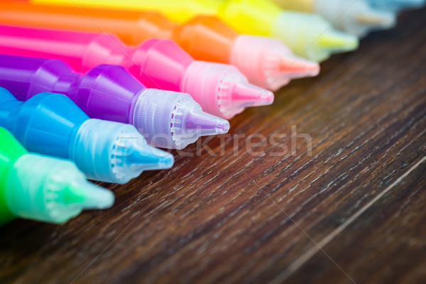Bottles with colorful dry pigments on wooden background Stock photo © bubutu