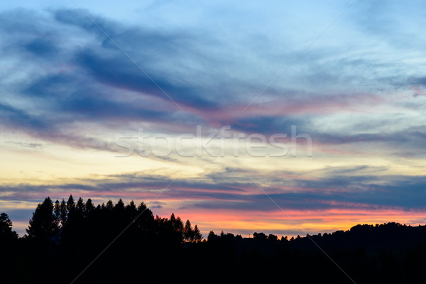 Zonsondergang stormachtig wolken velden heuvels bergen Stockfoto © bubutu