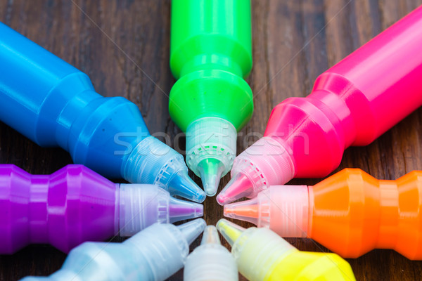 Bottles with colorful dry pigments on wooden background Stock photo © bubutu