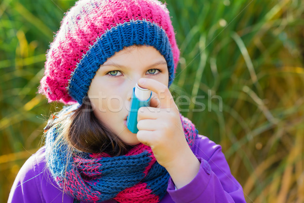 Girl Using Inhaler on a autumn day Stock photo © bubutu