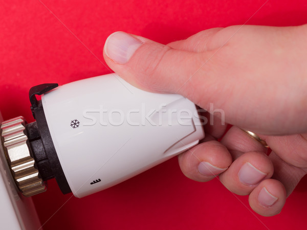 Radiátor termosztát kéz piros közelkép szoba Stock fotó © bubutu