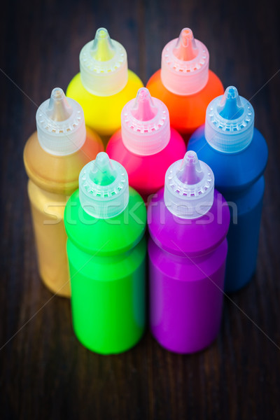 Bottles with colorful dry pigments on wooden background Stock photo © bubutu
