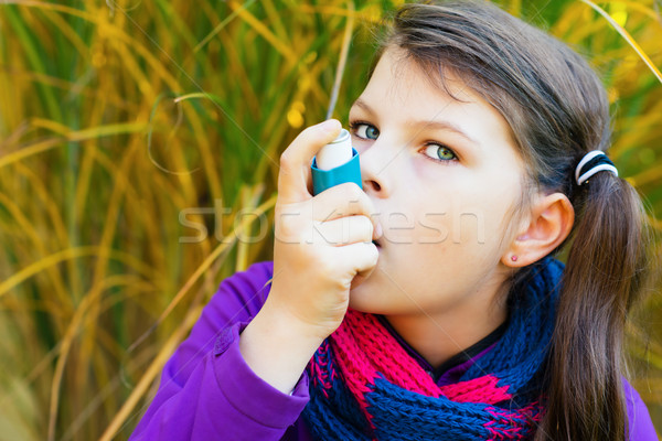 Girl Using Inhaler on a autumn day Stock photo © bubutu
